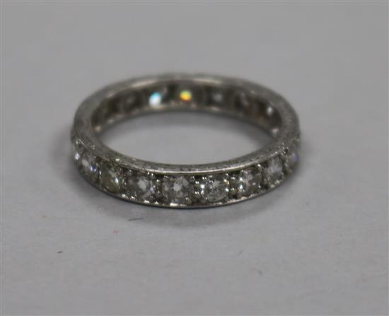 A platinum and diamond full eternity ring, set with twenty round cut diamonds and numbered 6122, size M.